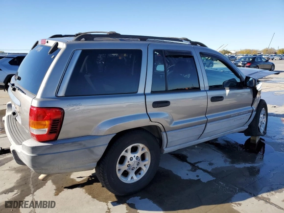 1999 Jeep Grand Cherokee Laredo with VIN 1J4GW58NXXC776438, listed as a Copart auction lot 84412044 with 163,060 mi miles and Salvage Title. Bid and sale history available at carsss.com. Image 3.