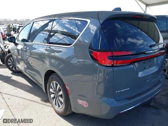 2023 Chrysler Pacifica Hybrid Touring L with VIN 2C4RC1L73PR509853, listed as a IAAI auction lot 41690872 with 83,014 mi miles. Bid and sale history available at carsss.com. Image 3.