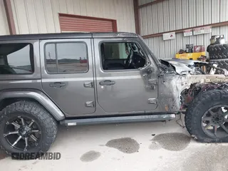 2019 Jeep Wrangler Unlimited Sahara with VIN 1C4HJXEG7KW661801, listed as a IAAI auction lot 40848731 with Not provided miles and . Bid and sale history available at DreamBid. Image 12.
