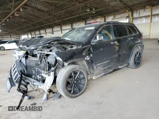 2015 Jeep Grand Cherokee Limited with VIN 1C4RJEBG7FC217855, listed as a Copart auction lot 50642135 with 124,130 mi miles and Salvage Title. Bid and sale history available at carsss.com. Image 1.