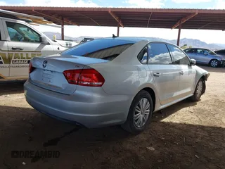 2015 Volkswagen Passat 1.8T Wolfsburg Ed with VIN 1VWAT7A31FC028990, listed as a IAAI auction lot 41778229 with 73,553 mi miles. Bid and sale history available at carsss.com. Image 4.
