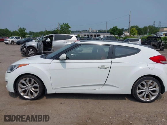 2012 Hyundai Veloster w/Gray Int with VIN KMHTC6AD3CU051395, listed as a IAAI auction lot 42489038 with 153,319 mi miles and . Bid and sale history available at DreamBid. Image 6.