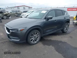 2020 Mazda CX-5 Grand Touring with VIN JM3KFBDM4L0829861, listed as a IAAI auction lot 41826250 with 62,091 mi miles and . Bid and sale history available at carsss.com. Image 18.
