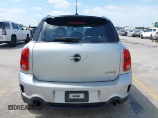 2013 MINI Countryman S z VIN WMWZC3C50DWP21636, wystawiony jako IAAI lot #42113244 z przebiegiem 85 344 mil mil oraz . Historia ofert i sprzedaży dostępna na DreamBid. Obrazek 16.