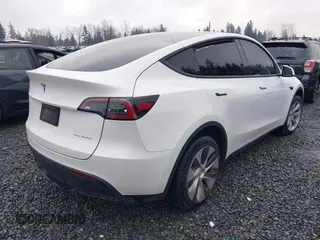 2022 Tesla Model Y Long Range z VIN 7SAYGDEE6NF451259, wystawiony jako IAAI lot #41200775 z przebiegiem 59 683 mil mil oraz . Historia ofert i sprzedaży dostępna na DreamBid. Obrazek 4.