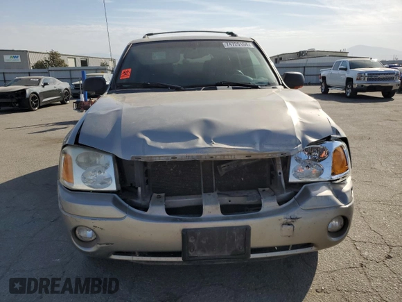 2003 GMC Envoy SLE with VIN 1GKDS13S332390989, listed as a Copart auction lot 74729104 with 127,680 mi miles and Salvage Title. Bid and sale history available at DreamBid. Image 5.