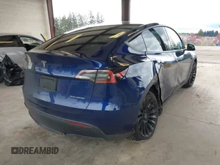 2023 Tesla Model Y Long Range with VIN 7SAYGDEEXPF621397, listed as a IAAI auction lot 41922714 with 29,460 mi miles. Bid and sale history available at carsss.com. Image 4.