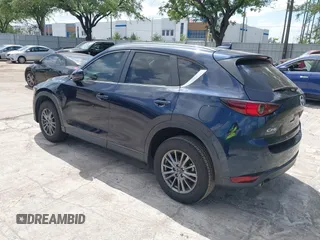 2017 Mazda CX-5 Touring with VIN JM3KFACL0H0227615, listed as a IAAI auction lot 42063618 with 72,291 mi miles. Bid and sale history available at carsss.com. Image 3.