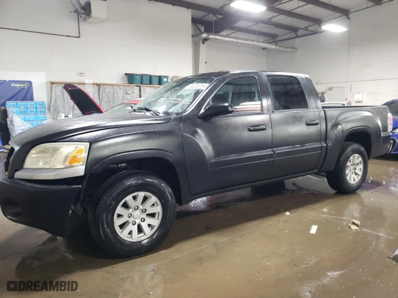 2006 Mitsubishi Raider LS with VIN 1Z7HC28K56S537721, listed as a Copart auction lot 83036764 with 114,576 mi miles and Salvage Title. Bid and sale history available at carsss.com. Image 1.