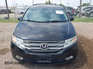 2013 Honda Odyssey Touring with VIN 5FNRL5H95DB086041, listed as a IAAI auction lot 42477974 with 213,343 mi miles and . Bid and sale history available at DreamBid. Image 12.