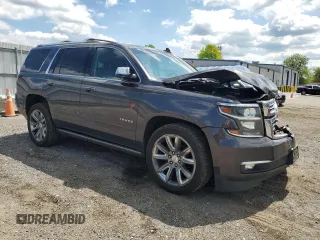 2015 Chevrolet Tahoe LTZ with VIN 1GNSKCKC9FR698924, listed as a Copart auction lot 56196895 with 184,740 mi miles and Salvage title. Bid and sale history available at DreamBid. Image 4.