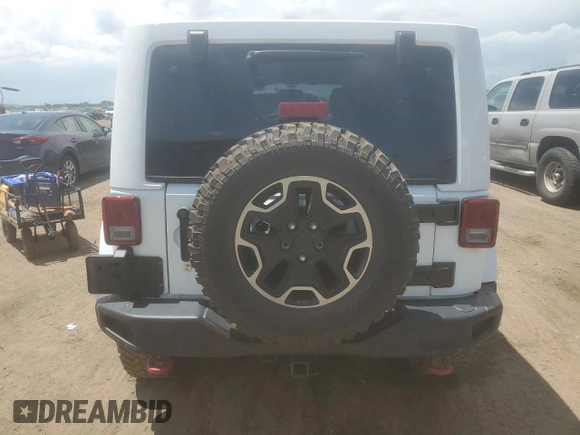 2017 Jeep Wrangler Unlimited Rubicon z VIN 1C4BJWFG1HL578230, wystawiony jako Copart lot #59957075 z przebiegiem 59 701 mil mil oraz Szkoda całkowita • Salvage title. Historia ofert i sprzedaży dostępna na DreamBid. Obrazek 6.