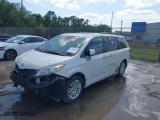 2015 Toyota Sienna XLE with VIN 5TDYK3DC8FS566058, listed as a IAAI auction lot 41908422 with 215,503 mi miles. Bid and sale history available at carsss.com. Image 2.