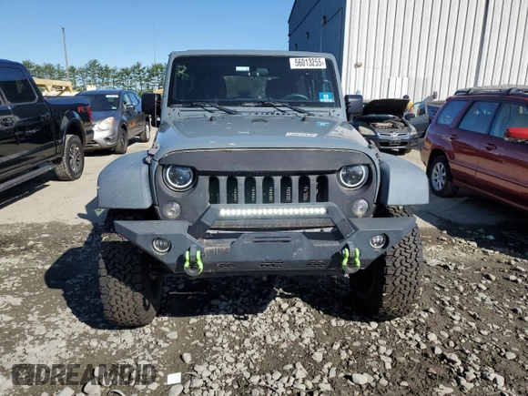2015 Jeep Wrangler Unlimited Willys Wheeler with VIN 1C4BJWDG5FL609110, listed as a Copart auction lot 56013255 with 153,202 mi miles and Clean Title. Bid and sale history available at DreamBid. Image 5.