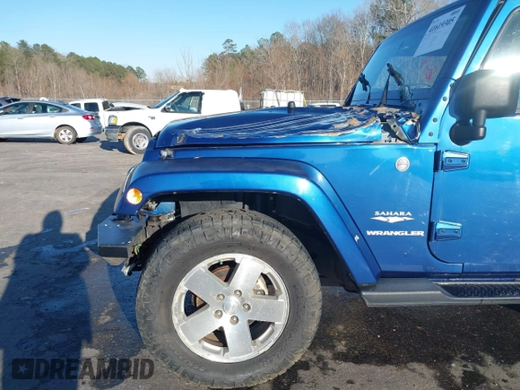 2009 Jeep Wrangler Sahara z VIN 1J4FA54199L722192, wystawiony jako IAAI lot #41619305 z przebiegiem 105 545 mil mil oraz . Historia ofert i sprzedaży dostępna na DreamBid. Obrazek 6.