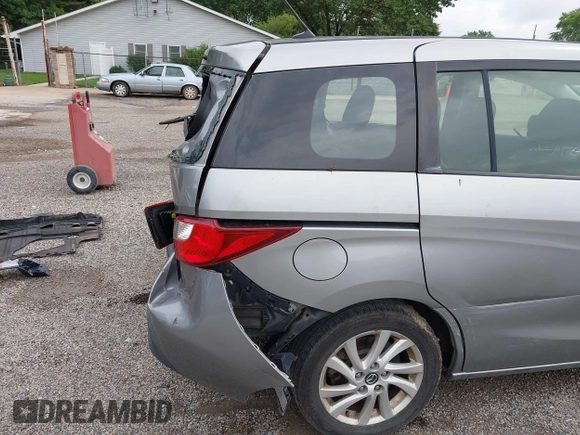 2014 Mazda 5 Sport z VIN JM1CW2BL5E0172594, wystawiony jako IAAI lot #42628707 z przebiegiem 180 369 mil mil oraz . Historia ofert i sprzedaży dostępna na DreamBid. Obrazek 18.