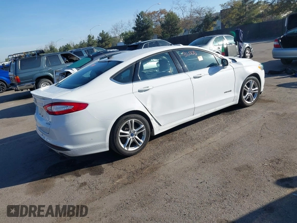 2015 Ford Fusion SE Hybrid with VIN 3FA6P0LU3FR249444, listed as a IAAI auction lot 41602659 with 145,024 mi miles. Bid and sale history available at carsss.com. Image 4.