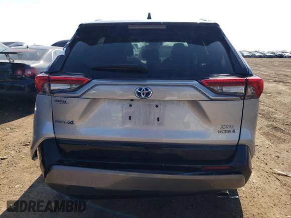 2021 Toyota RAV4 Hybrid XSE with VIN 2T3E6RFV9MW013200, listed as a Copart auction lot 52163255 with 58,336 mi miles and Salvage title. Bid and sale history available at DreamBid. Image 6.