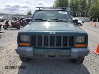 1999 Jeep Cherokee Sport with VIN 1J4FF68S2XL570795, listed as a Copart auction lot 61860585 with 320,467 mi miles and Salvage title. Bid and sale history available at DreamBid. Image 5.