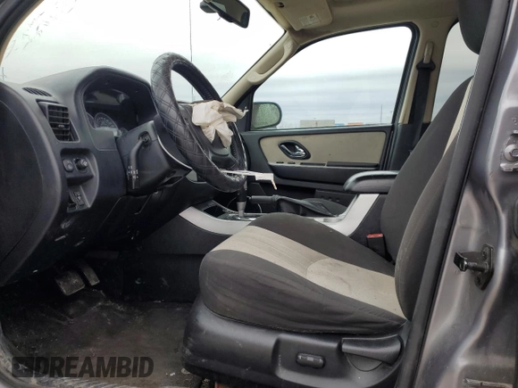2007 Mercury Mariner Luxury with VIN 4M2YU91107KJ07772, listed as a Copart auction lot 42867545 with 128,235 mi miles and Salvage title. Bid and sale history available at DreamBid. Image 7.