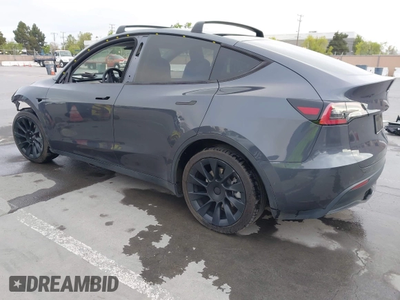 2021 Tesla Model Y Long Range with VIN 5YJYGAEE0MF223140, listed as a IAAI auction lot 42007701 with 55,308 mi miles. Bid and sale history available at carsss.com. Image 3.