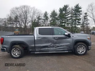 2021 GMC Sierra 1500 SLT z VIN 3GTU9DET8MG413416, wystawiony jako IAAI lot #41935465 z przebiegiem 70 547 mil mil oraz . Historia ofert i sprzedaży dostępna na DreamBid. Obrazek 13.
