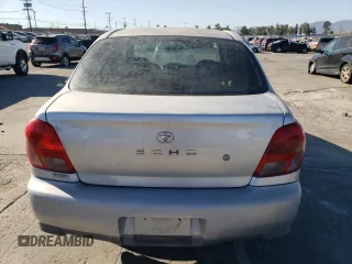 2002 Toyota ECHO with VIN JTDBT123025027203, listed as a Copart auction lot 70723424 with 187,299 mi miles and Salvage Title. Bid and sale history available at DreamBid. Image 6.