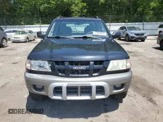 2003 Isuzu Rodeo z VIN 4S2CK58W734311374, wystawiony jako Copart lot #57949325 z przebiegiem 247 580 mil mil oraz Tytuł czysty. Historia ofert i sprzedaży dostępna na DreamBid. Obrazek 5.