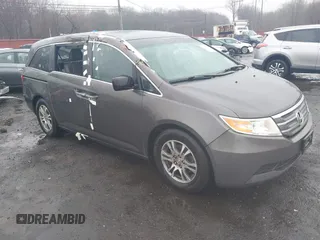 2012 Honda Odyssey EX-L with VIN 5FNRL5H64CB037689, listed as a IAAI auction lot 41857822 with 121,601 mi miles and . Bid and sale history available at carsss.com. Image 1.