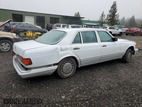 1990 Mercedes-Benz 300 with VIN WDBCA25D9LA550909, listed as a Copart auction lot 82717124 with 221,701 mi miles and Salvage Title. Bid and sale history available at DreamBid. Image 3.
