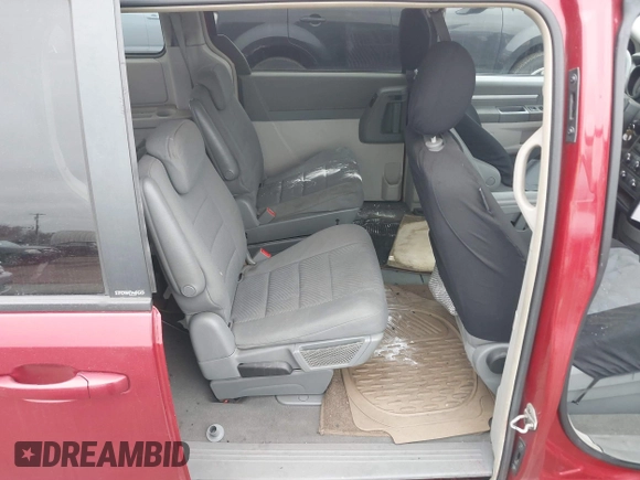 2009 Dodge Grand Caravan SXT z VIN 2D8HN54X69R593635, wystawiony jako IAAI lot #39235325 z przebiegiem 207 996 mil mil oraz . Historia ofert i sprzedaży dostępna na DreamBid. Obrazek 8.