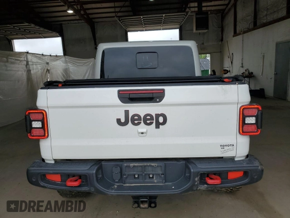 2020 Jeep Gladiator Rubicon z VIN 1C6JJTBG4LL102523, wystawiony jako Copart lot #54735955 z przebiegiem 104 579 mil mil oraz Szkoda całkowita • Salvage title. Historia ofert i sprzedaży dostępna na DreamBid. Obrazek 6.