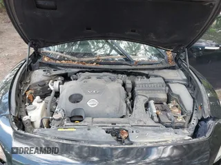 2013 Nissan Maxima S with VIN 1N4AA5AP0DC828375, listed as a IAAI auction lot 42215336 with 210,398 mi miles and . Bid and sale history available at DreamBid. Image 10.