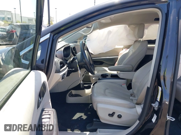 2021 Chrysler Pacifica Hybrid Touring L with VIN 2C4RC1L71MR599631, listed as a IAAI auction lot 42151965 with 67,401 mi miles and . Bid and sale history available at DreamBid. Image 5.