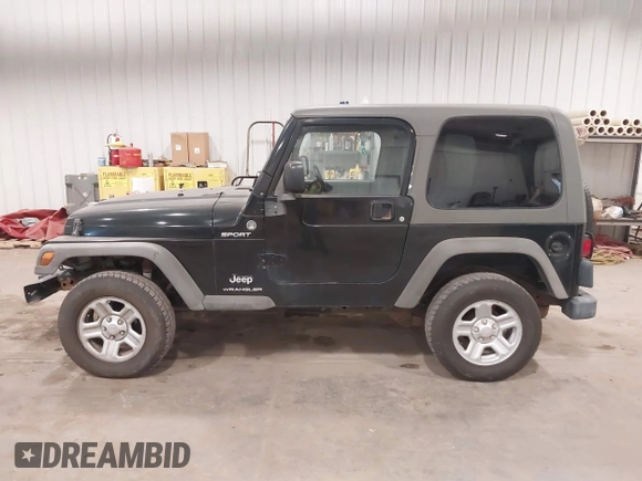 2006 Jeep Wrangler Sport Right Hand Drive with VIN 1J4F449S56P741328, listed as a IAAI auction lot 41476847 with 67,203 mi miles. Bid and sale history available at carsss.com. Image 14.