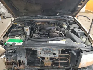 2000 GMC Jimmy SLT Convenience with VIN 1GKDT13WXY2109634, listed as a Copart auction lot 49811075 with 190,465 mi miles and Salvage Title. Bid and sale history available at carsss.com. Image 13.