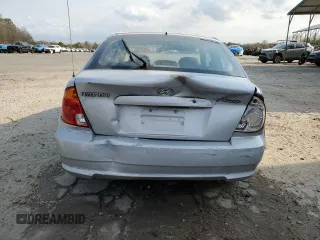 2003 Hyundai Accent GL with VIN KMHCG35CX3U270374, listed as a Copart auction lot 47240325 with 122,739 mi miles and Salvage Title. Bid and sale history available at carsss.com. Image 6.