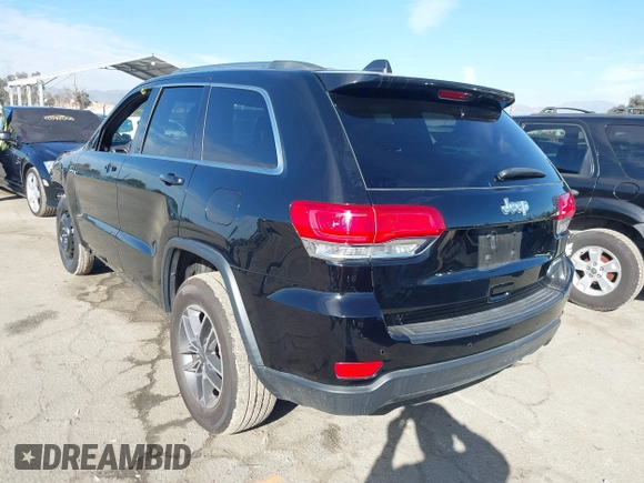 2019 Jeep Grand Cherokee Altitude with VIN 1C4RJEAG7KC852263, listed as a IAAI auction lot 41590946 with 83,356 mi miles and . Bid and sale history available at DreamBid. Image 3.