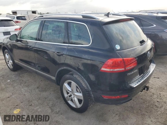 2012 Volkswagen Touareg Exec with VIN WVGEF9BP1CD011407, listed as a Copart auction lot 79199754 with 57,376 mi miles and Salvage Title. Bid and sale history available at DreamBid. Image 2.