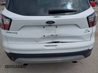 2018 Ford Escape SE z VIN 1FMCU9GDXJUC99453, wystawiony jako IAAI lot #42195202 z przebiegiem 191 840 mil mil oraz . Historia ofert i sprzedaży dostępna na DreamBid. Obrazek 6.
