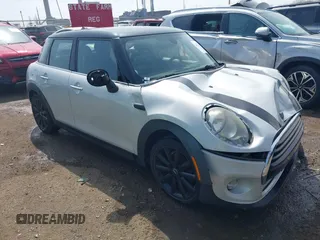 2016 MINI Hardtop 4 Door z VIN WMWXU1C54G2A93779, wystawiony jako IAAI lot #41933339 z przebiegiem 85 000 mil mil oraz . Historia ofert i sprzedaży dostępna na DreamBid. Obrazek 1.