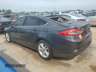 2018 Ford Fusion SE z VIN 3FA6P0H78JR261102, wystawiony jako Copart lot #69963883 z przebiegiem 120 068 mil mil oraz Czysty tytuł • Clean title. Historia ofert i sprzedaży dostępna na DreamBid. Obrazek 2.