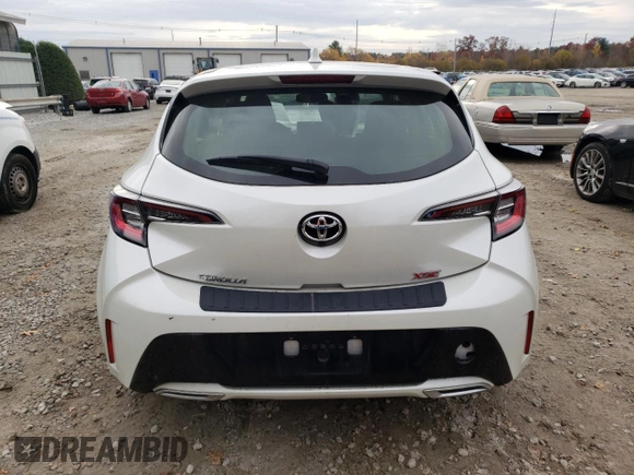 2019 Toyota Corolla Hatchback SE with VIN JTNK4RBEXK3051691, listed as a Copart auction lot 77159164 with 21,051 mi miles and Salvage Title. Bid and sale history available at carsss.com. Image 6.