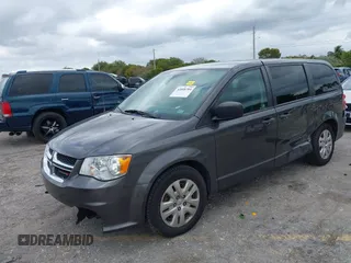2019 Dodge Grand Caravan SE with VIN 2C4RDGBGXKR796974, listed as a IAAI auction lot 42008704 with 129,229 mi miles and . Bid and sale history available at DreamBid. Image 2.