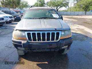 2000 Jeep Grand Cherokee Laredo z VIN 1J4GW48S8YC244168, wystawiony jako IAAI lot #41907447 z przebiegiem 243 154 mil mil oraz . Historia ofert i sprzedaży dostępna na DreamBid. Obrazek 6.
