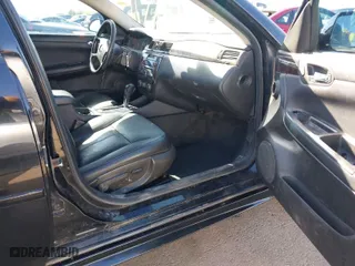 2013 Chevrolet Impala LTZ with VIN 2G1WC5E3XD1208357, listed as a IAAI auction lot 42053811 with 376,518 mi miles. Bid and sale history available at carsss.com. Image 5.