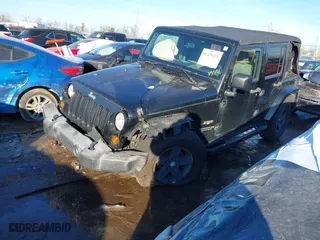 2008 Jeep Wrangler Unlimited Sahara with VIN 1J4GA59178L555035, listed as a IAAI auction lot 41420459 with 147,480 mi miles. Bid and sale history available at carsss.com. Image 16.
