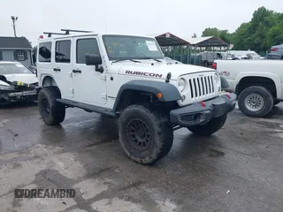 2014 Jeep Wrangler Unlimited Rubicon with VIN 1C4HJWFG4EL104827, listed as a IAAI auction lot 42236622 with 90,935 mi miles and . Bid and sale history available at DreamBid. Image 1.