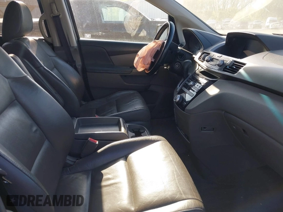2012 Honda Odyssey EX-L with VIN 5FNRL5H6XCB016801, listed as a IAAI auction lot 42112141 with 164,671 mi miles and . Bid and sale history available at carsss.com. Image 5.