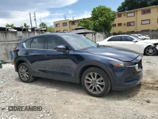 2021 Mazda CX-5 Grand Touring z VIN JM3KFBDM5M0464611, wystawiony jako Copart lot #62829065 z przebiegiem 20 525 mil mil oraz Nie do naprawy • Non repairable. Historia ofert i sprzedaży dostępna na DreamBid. Obrazek 4.